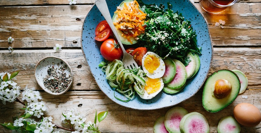image of food on table, vegetables, avocado, egg.