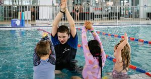 Three children in swimming lesson with PARC Swim teacher